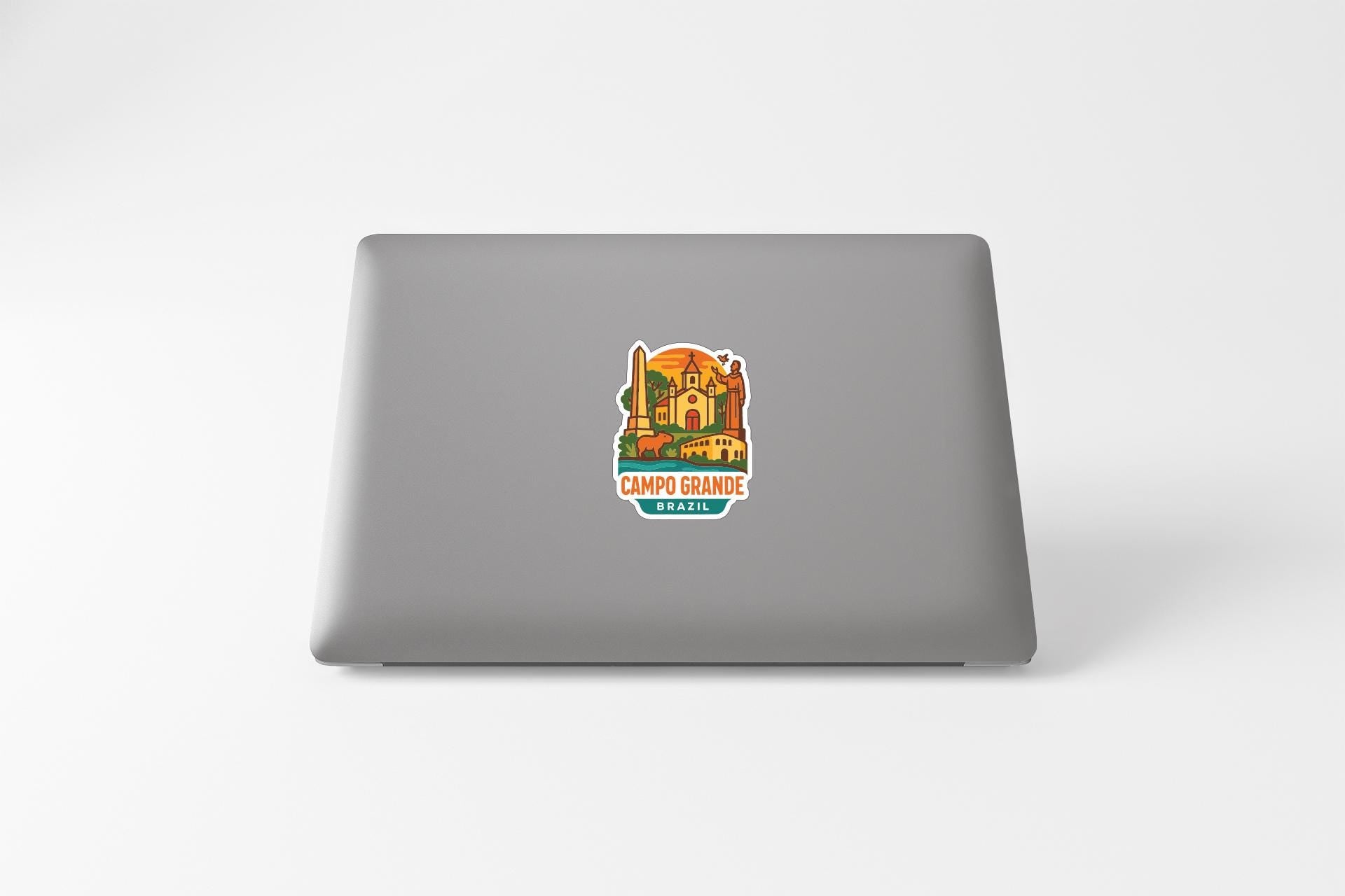 a sticker on the back of a laptop that displays a colorful illustration of a building and the text "Campo Granite Brazil".