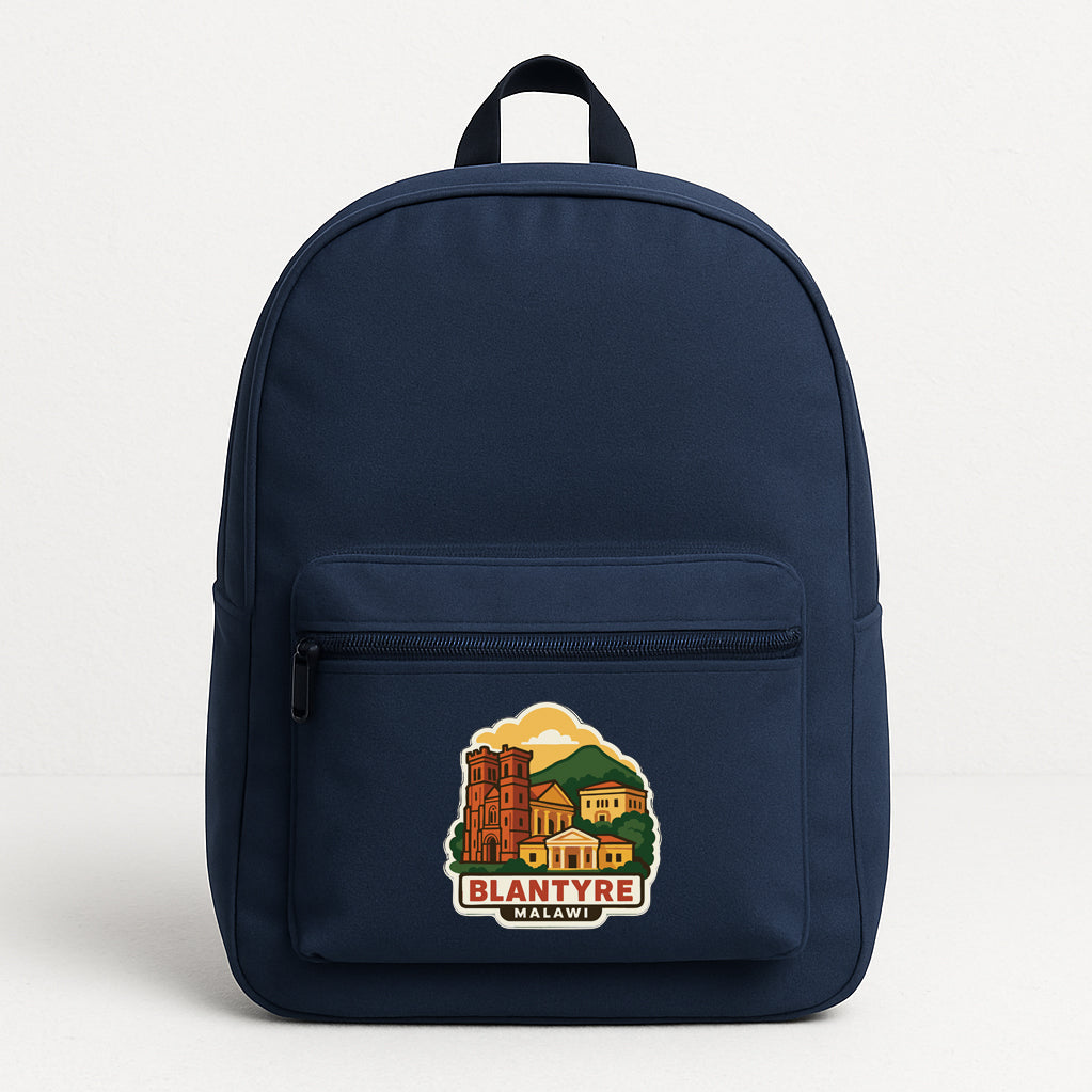 A navy blue backpack with a graphic design on the front pocket, featuring a castle and a mountain landscape.