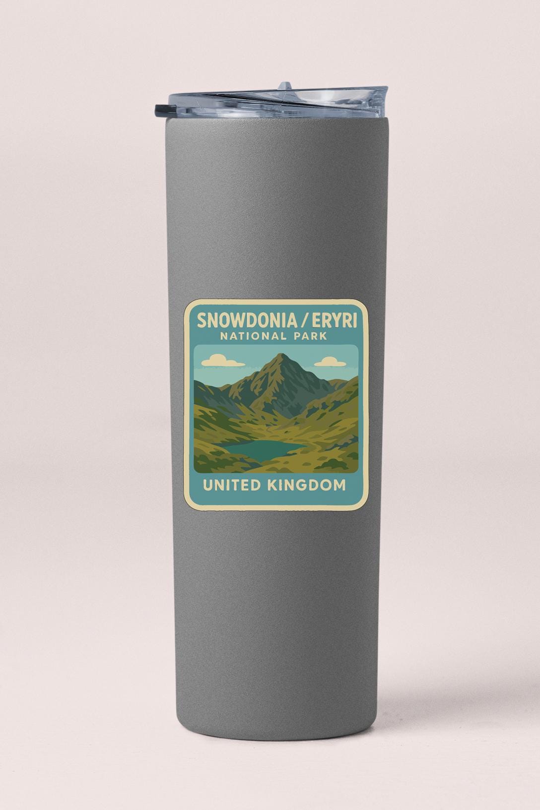 A gray insulated tumbler with a label that reads "Snowdonia / Eyrri National Park / United Kingdom".