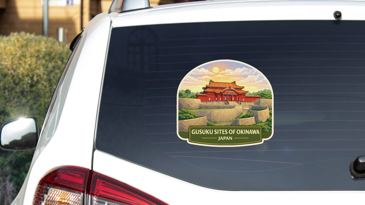A sticker on the rear window of a car, depicting a traditional Japanese temple surrounded by lush greenery.