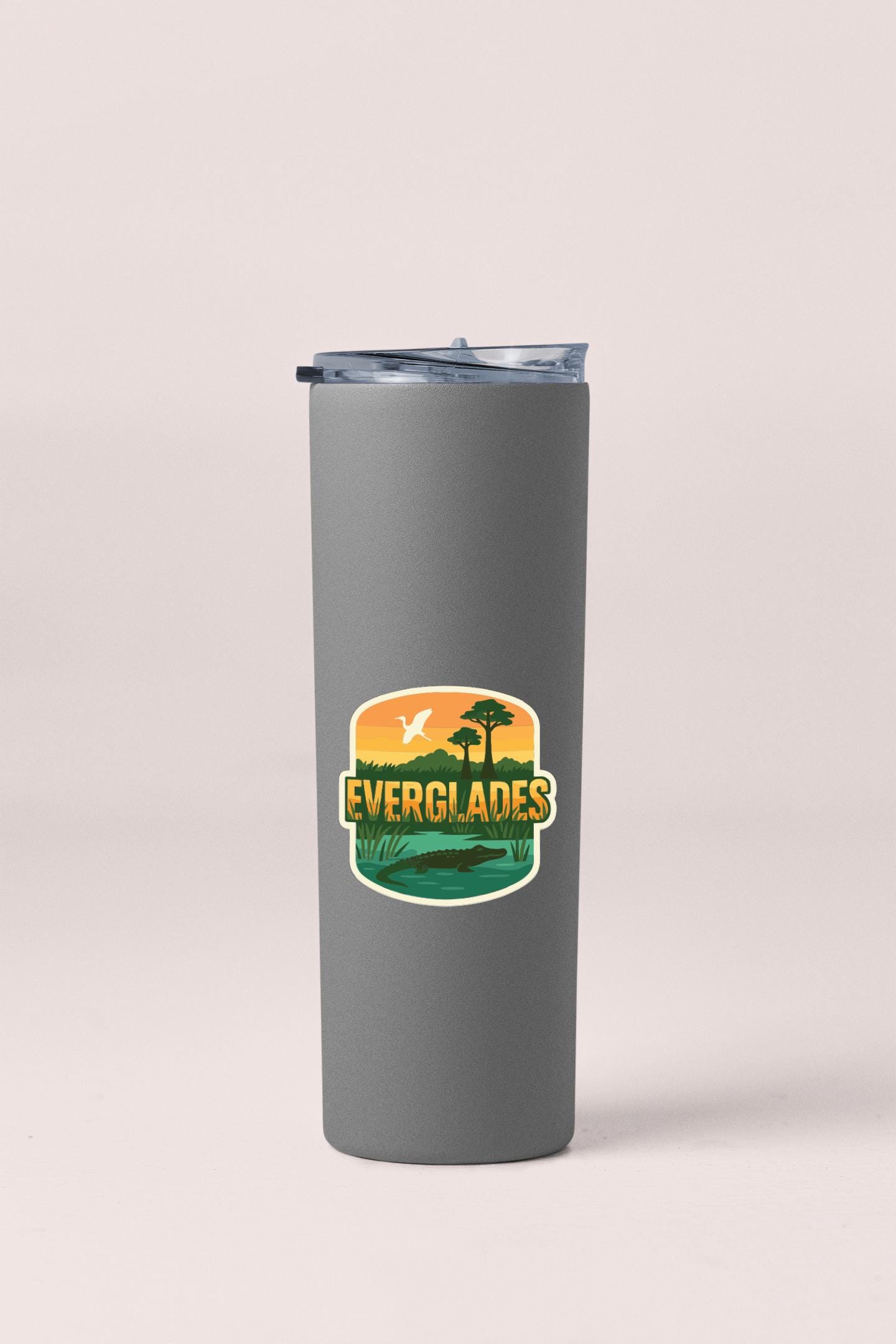 A gray insulated tumbler with a lid and a logo that says "EVERGLADES" on it.
