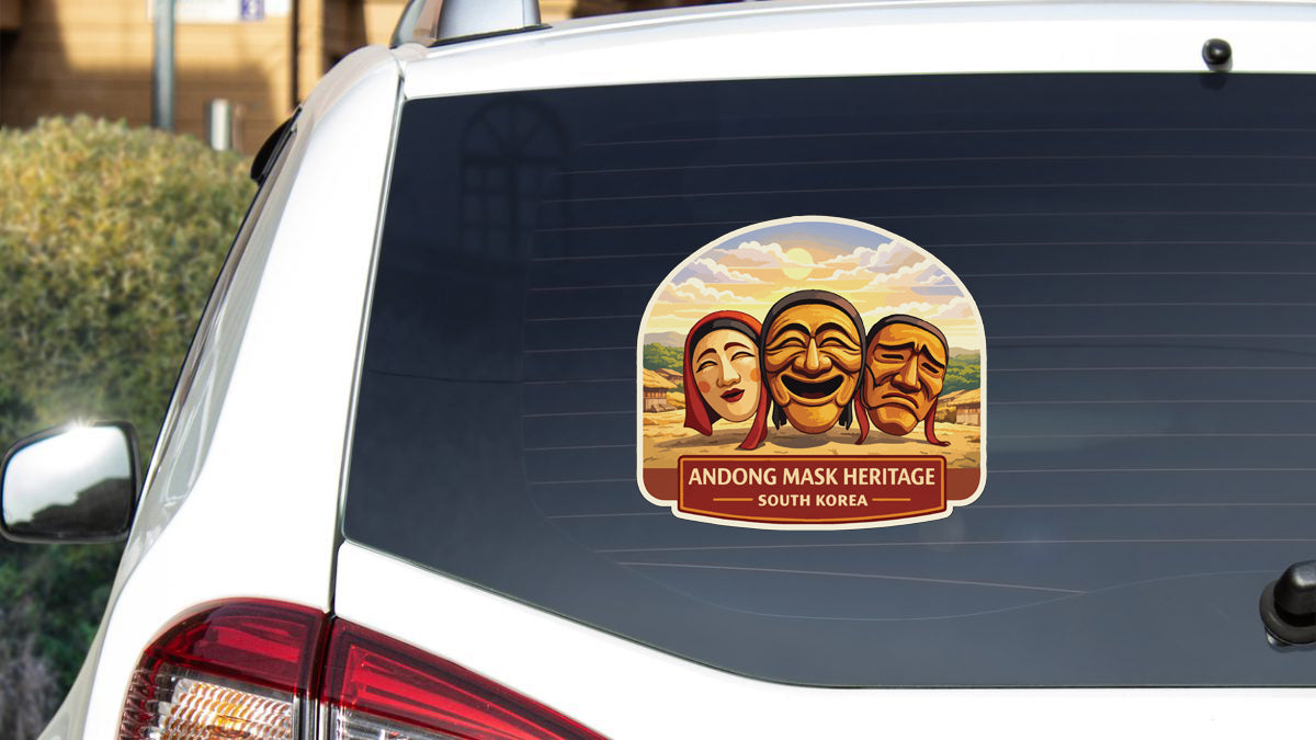 A sticker on the rear window of a car that features three Korean masks, along with the text "ANDONG MASK HERITAGE SOUTH KOREA".