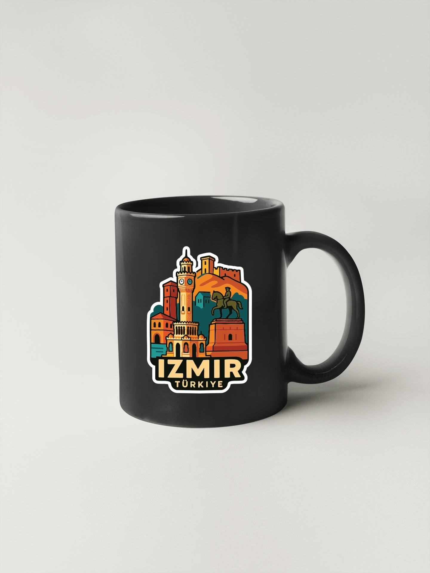 A black coffee mug with a colorful illustration of Istanbul, Turkey, featuring landmarks and architecture.