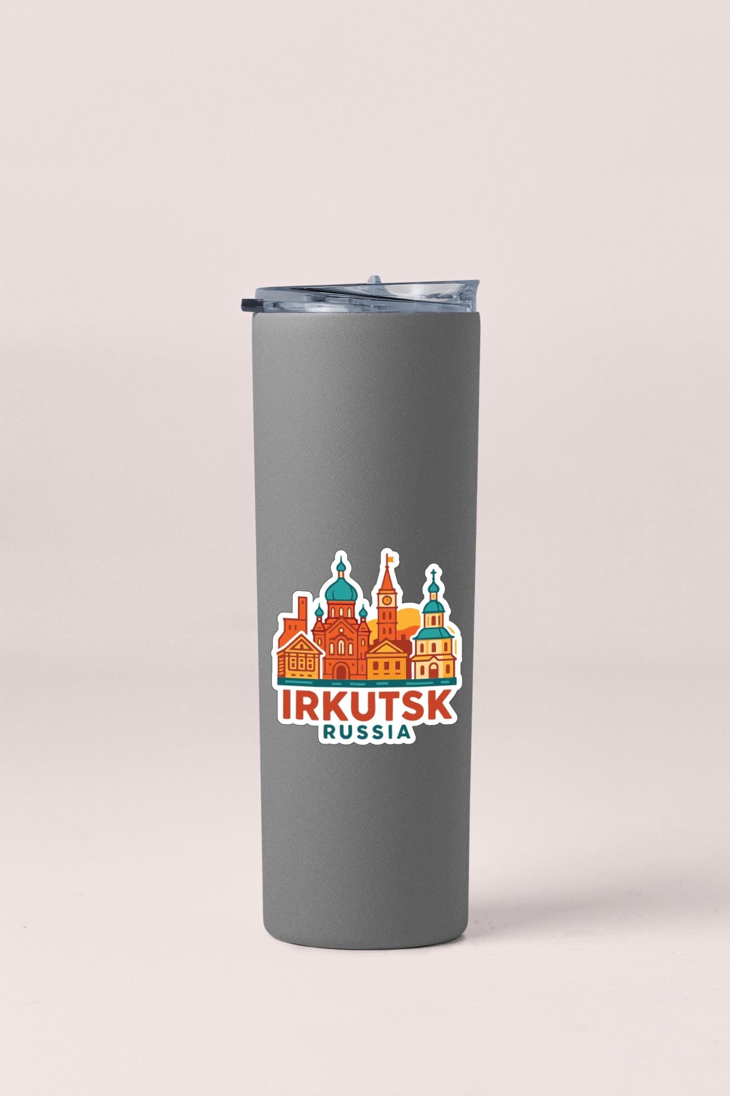 A gray insulated tumbler with a sticker depicting the city of Irkutsk, Russia.
