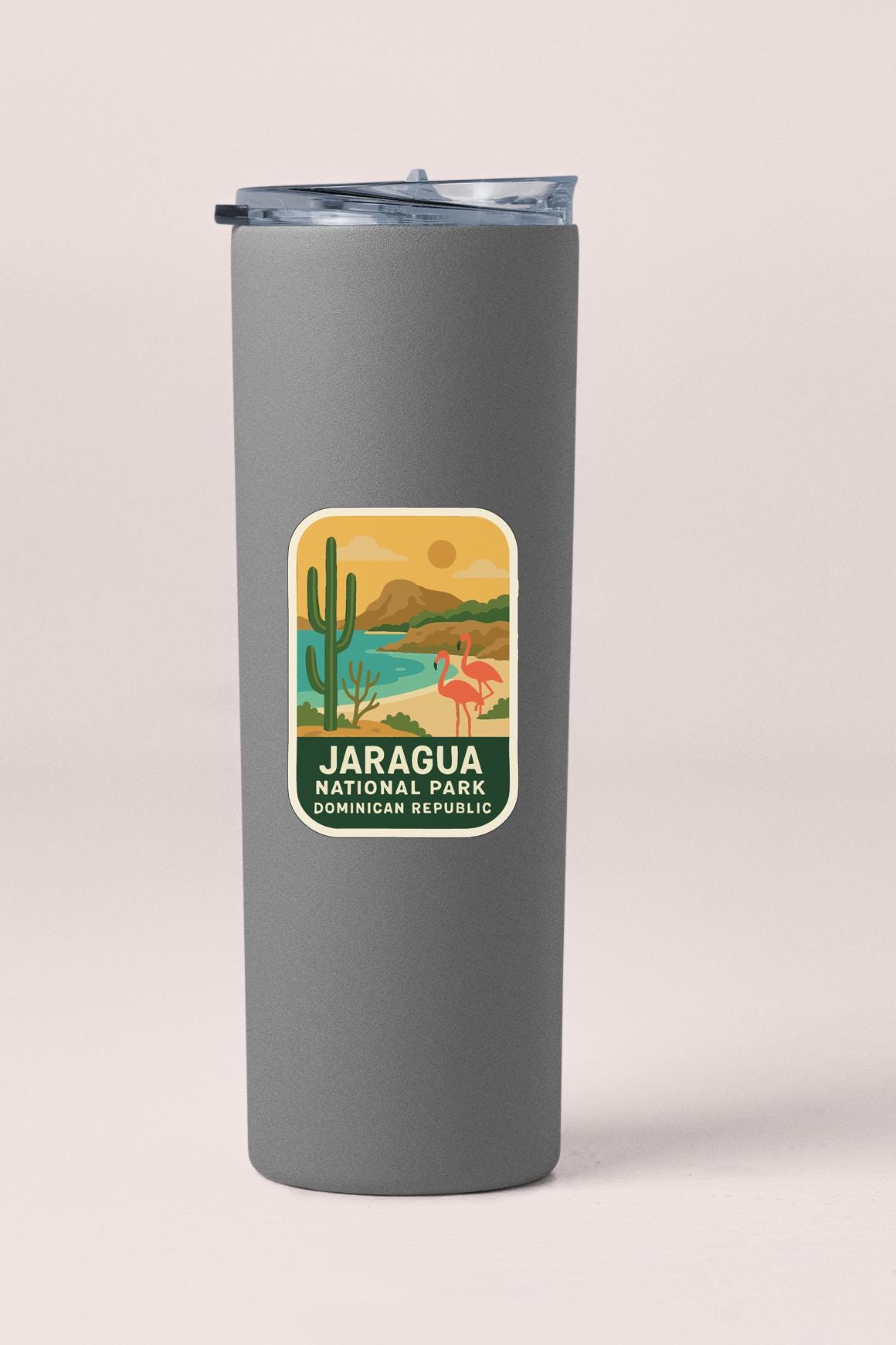 A gray insulated tumbler with a label that says "JARAGUA NATIONAL PARK DOMINICAN REPUBLIC".