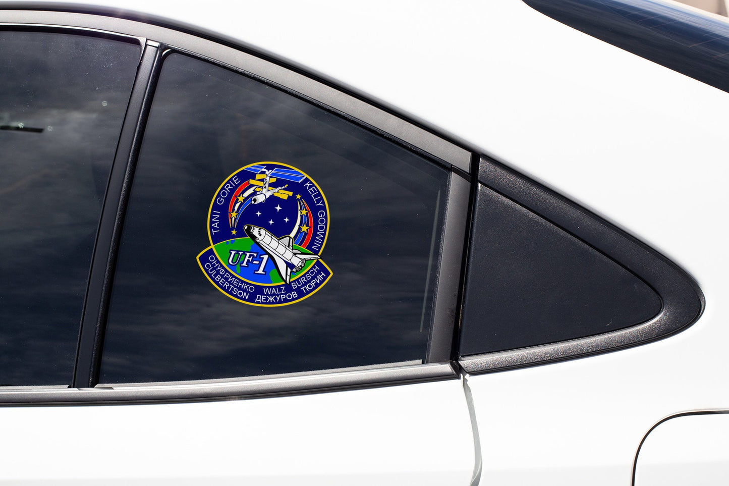 a close up of a car window with a sticker on it