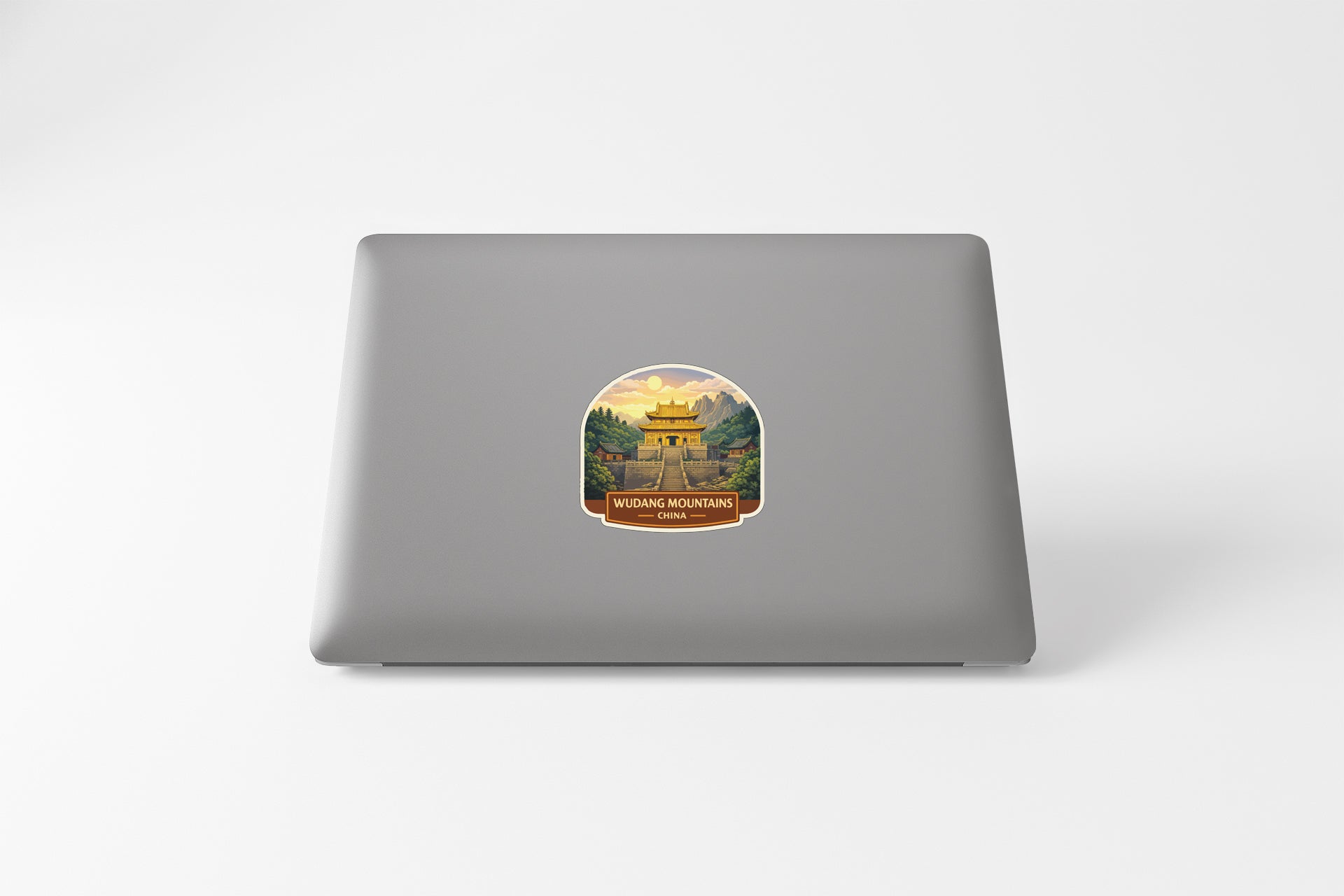 A sticker depicting a temple or building with a mountain landscape in the background.