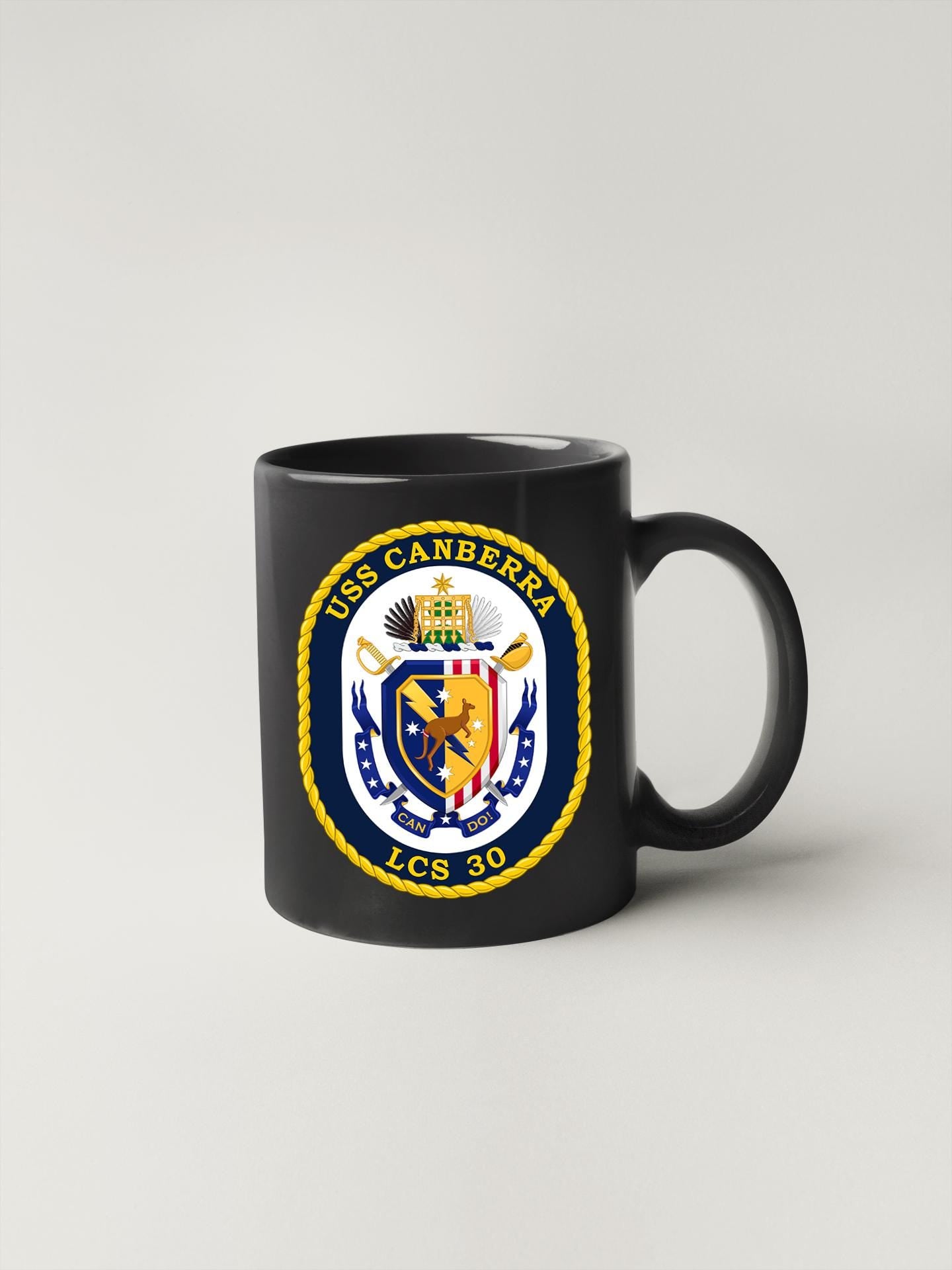 a black coffee mug with the seal of the united states of america