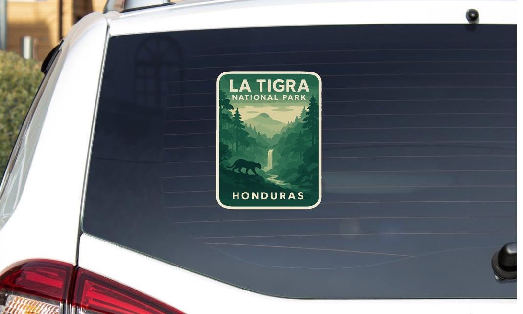 A sticker on the rear window of a car that says "LA TIGRA NATIONAL PARK HONDURAS".