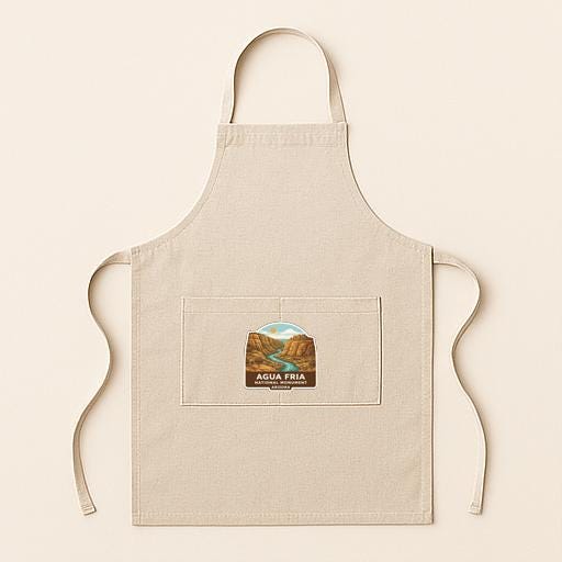 A beige apricot with a small pocket on the front, featuring a label that says "AQUAFRIA".