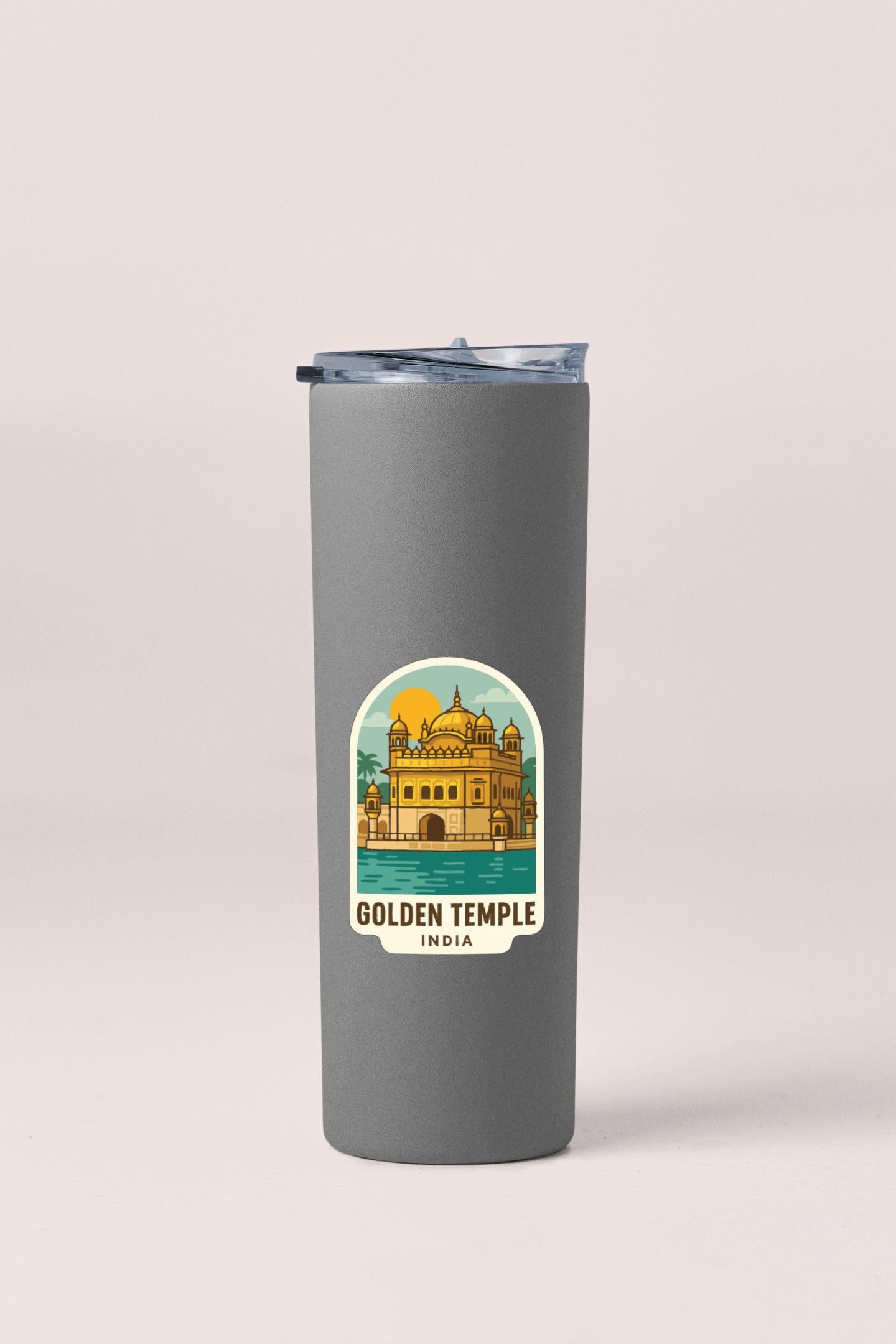A gray insulated tumbler with a sticker depicting the Golden Temple in India.