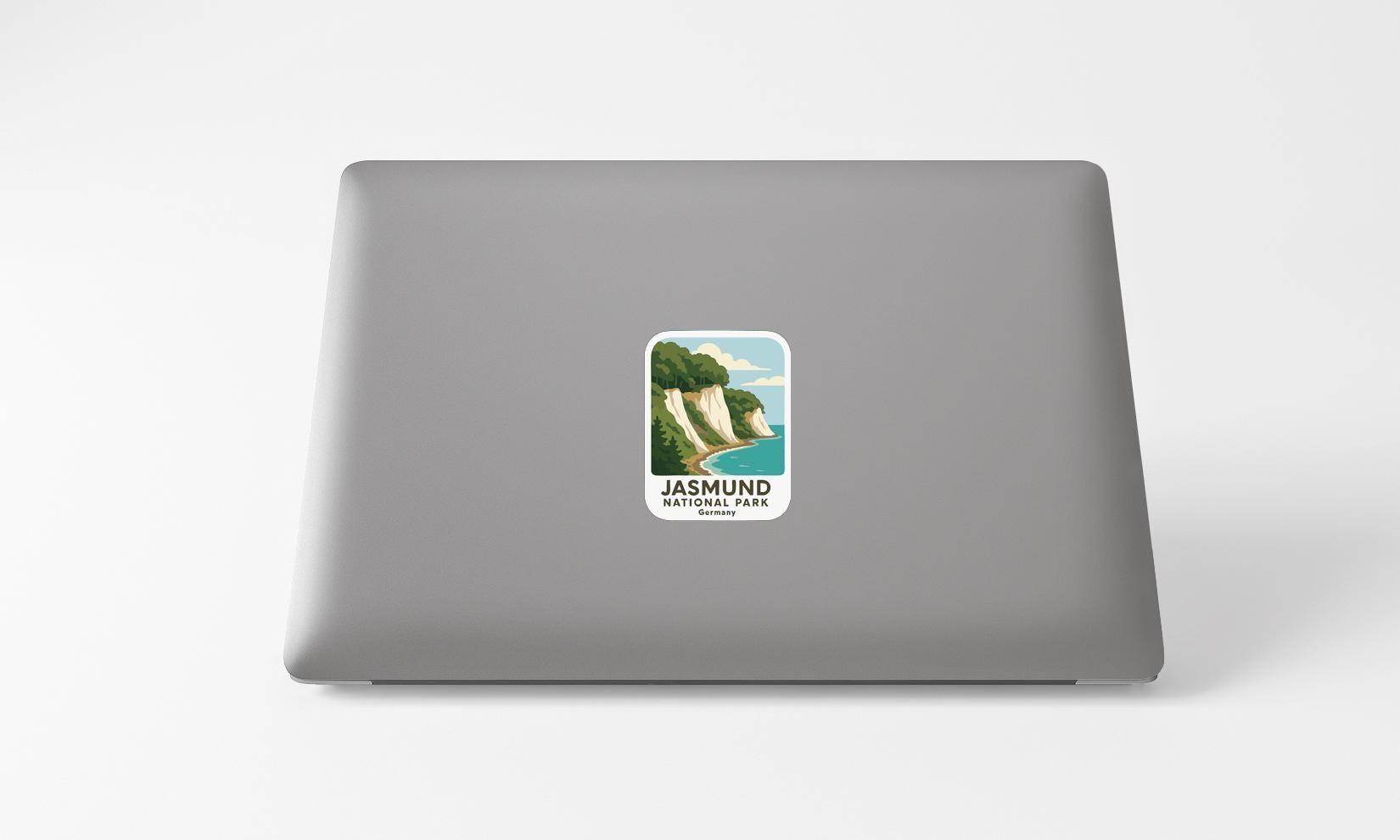 A sticker depicting a scenic landscape with cliffs and a body of water, representing the Jasund National Park.