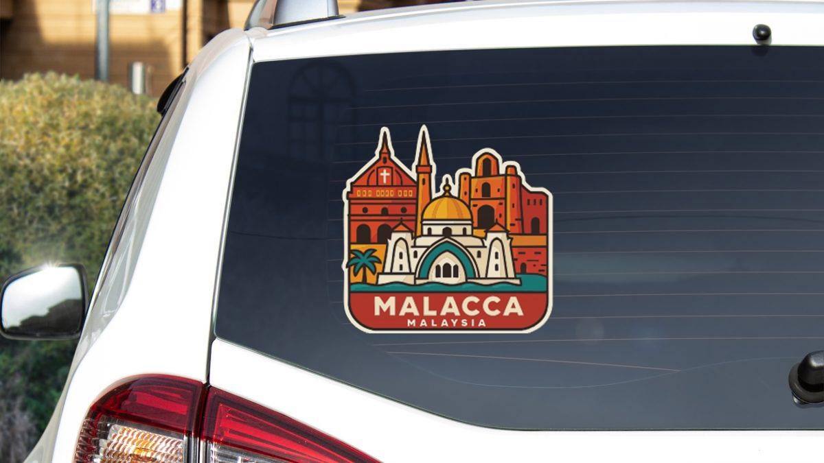 A sticker on the rear window of a car that features an illustration of a city skyline with buildings and a dome, along with the text "MALACCIA MALAYSIA".
