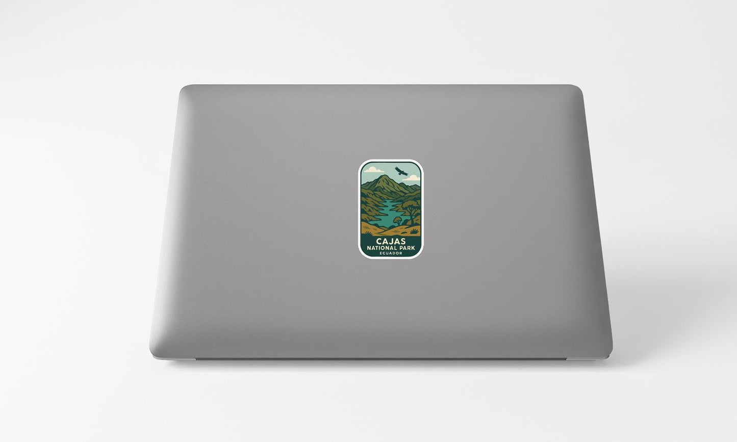 a sticker with a mountain landscape on a laptop.