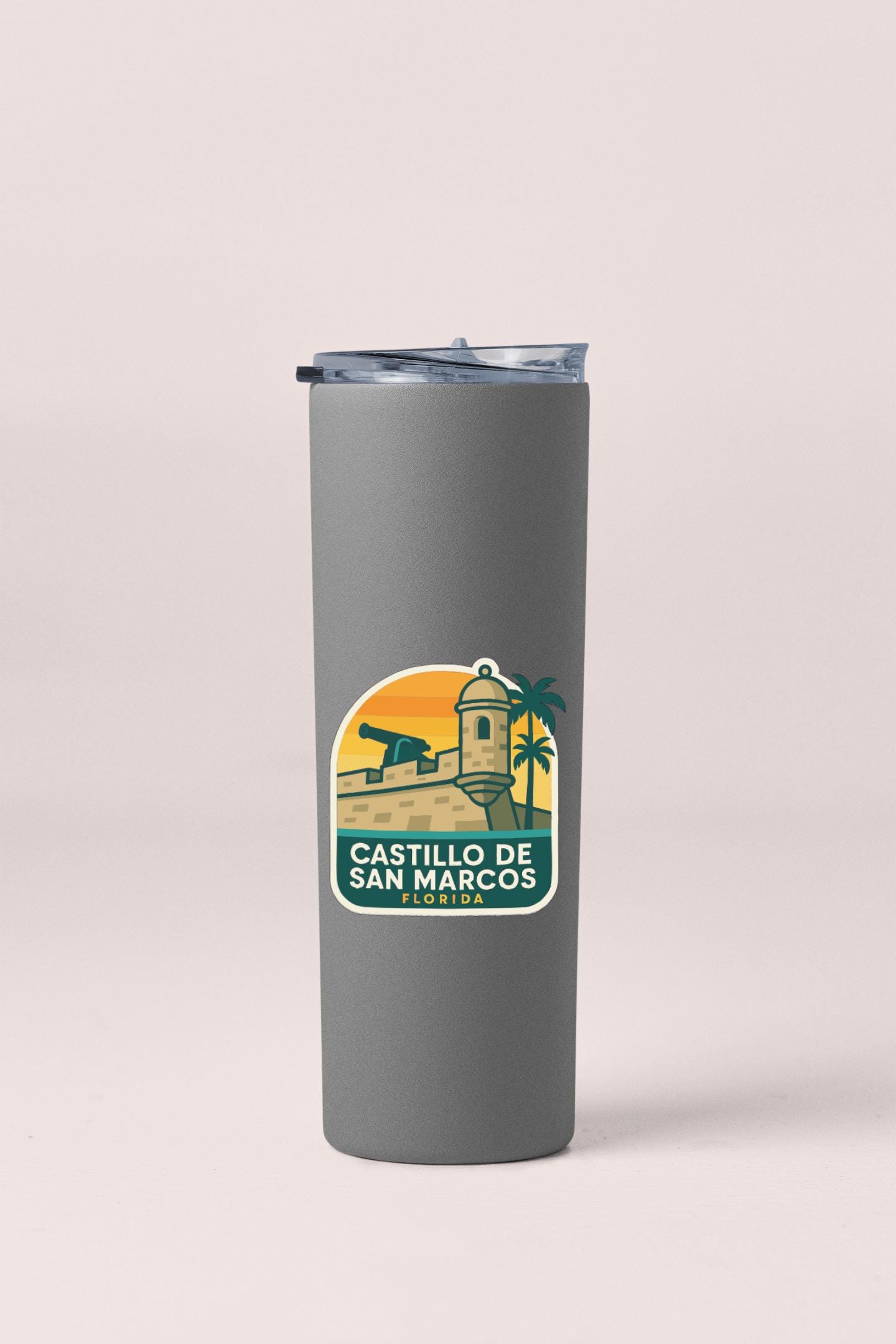 A gray insulated tumbler with a label that says "CASTILLO DE SAN MARCOS FLORIDA".