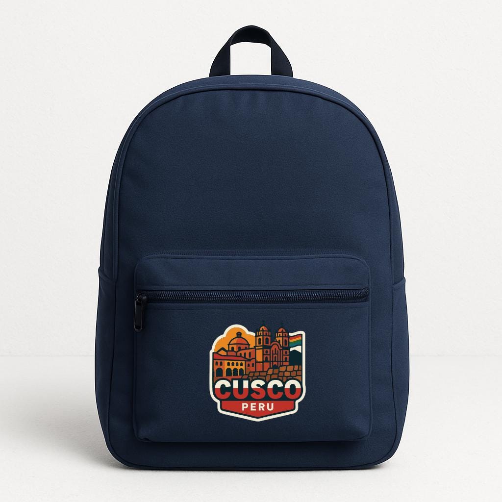 A navy blue backpack with a colorful sticker on the front that says "CUSCO PERU".