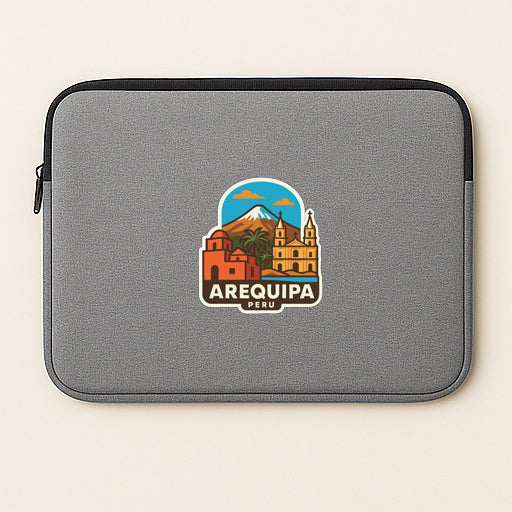 a gray laptop sleeve with a colorful sticker of Arequipa, Peru.