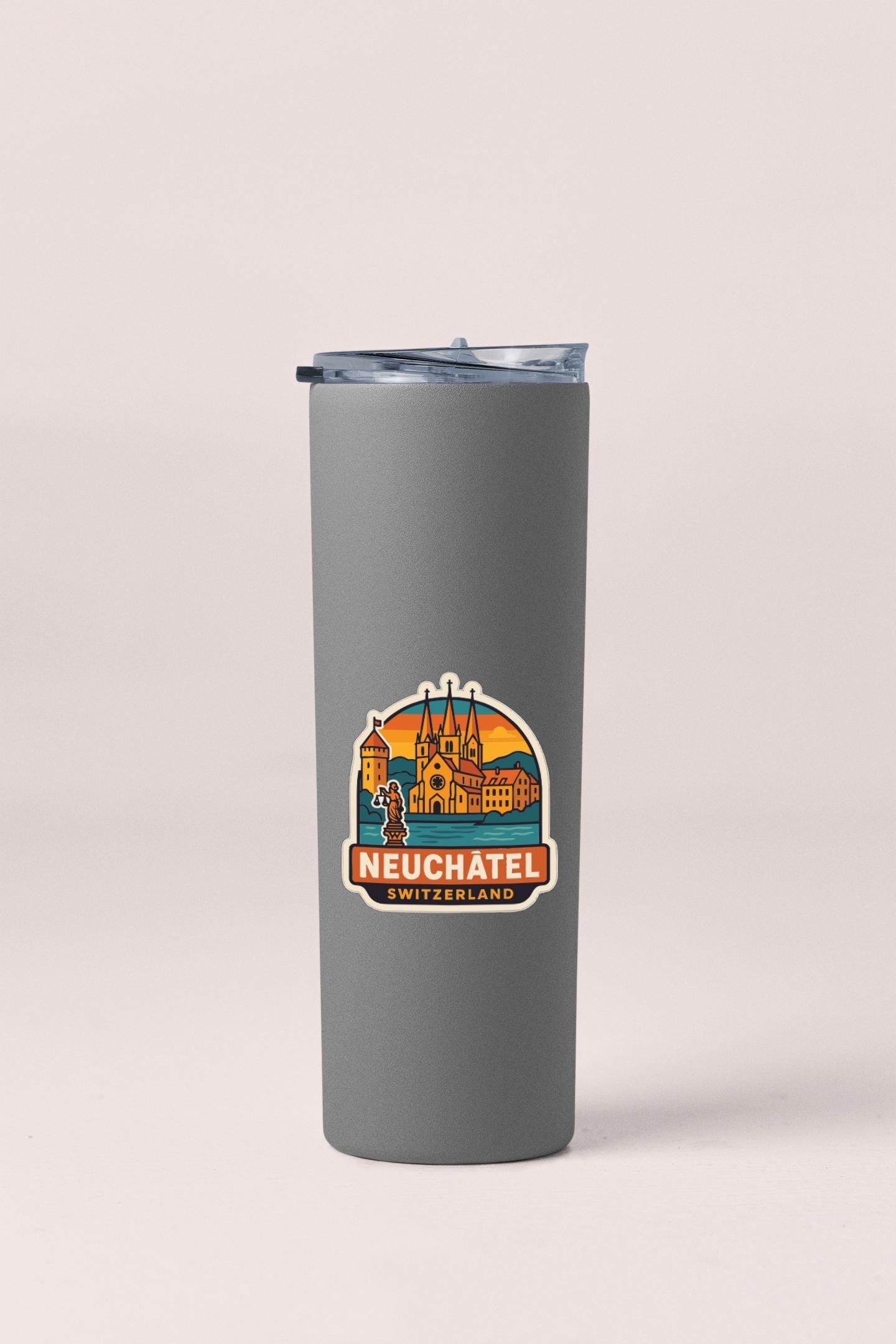 A gray insulated tumbler with a logo depicting a city skyline and the text "Neuchatel Switzerland" printed on it.
