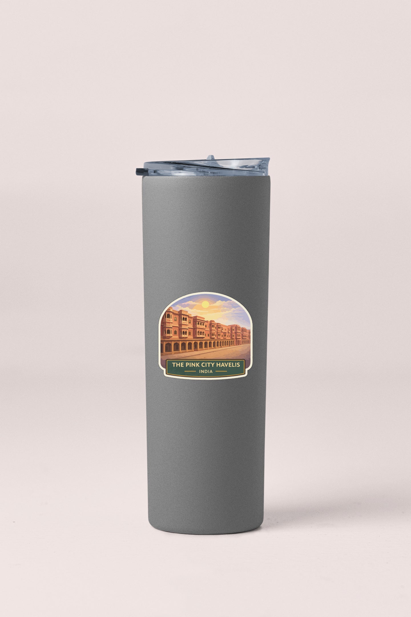 A gray insulated tumbler with a label that says "The Pine City Havelis, India".