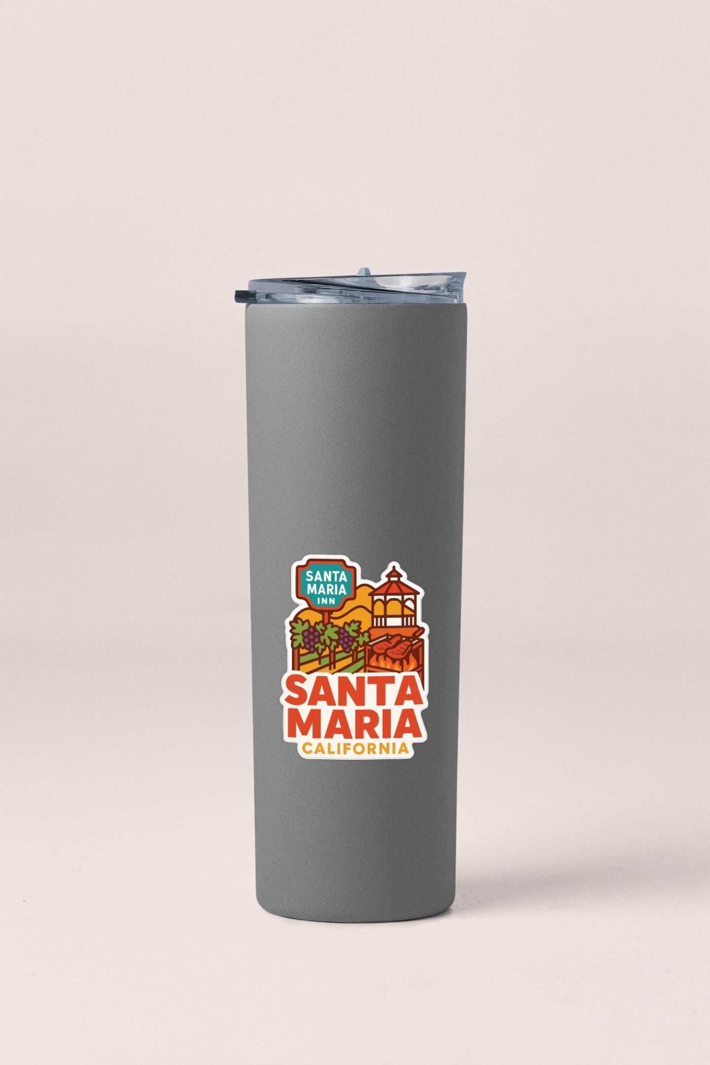 A gray insulated tumbler with a printed label that says "Santa Maria Inn, California".