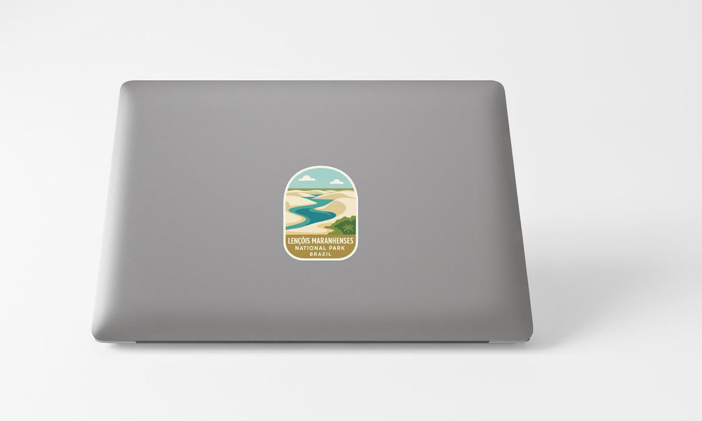 A sticker with a scenic landscape on a laptop.