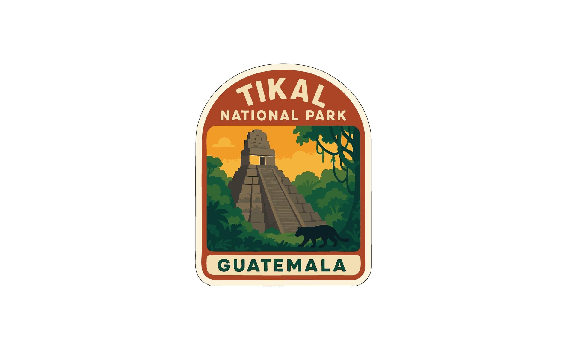 a sticker or emblem with the text "TIKAL NATIONAL PARK GUATEMALA" and an illustration of a pyramid surrounded by lush vegetation and a black panther.