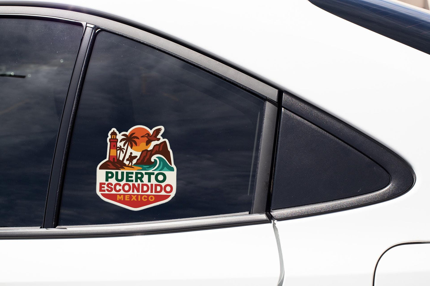 A car window with a sticker on it, featuring a colorful illustration of a tropical landscape with a lighthouse and palm trees.