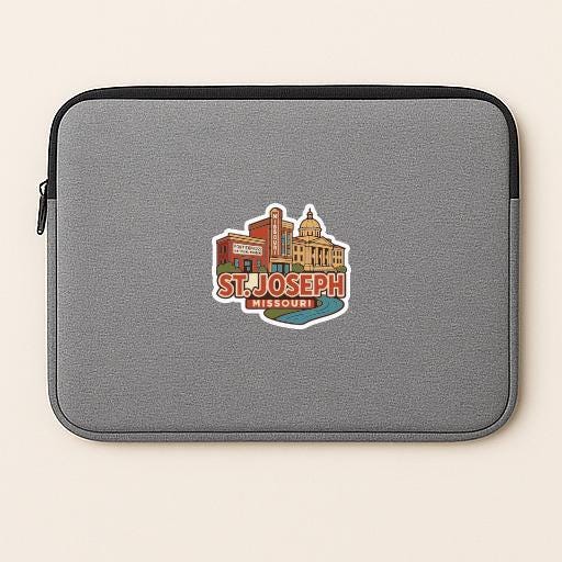 a gray laptop sleeve with a sticker depicting St. Joseph, Missouri.