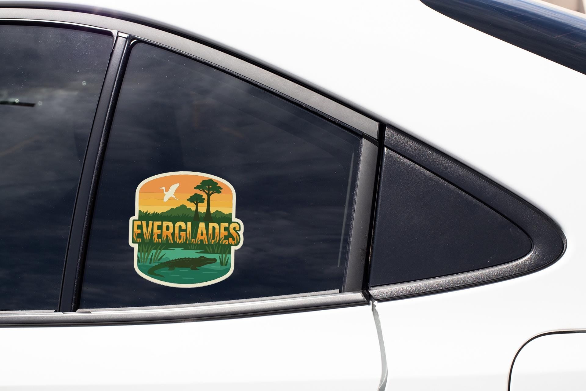 A sticker on the side of a car window that says "EVERGLADES".