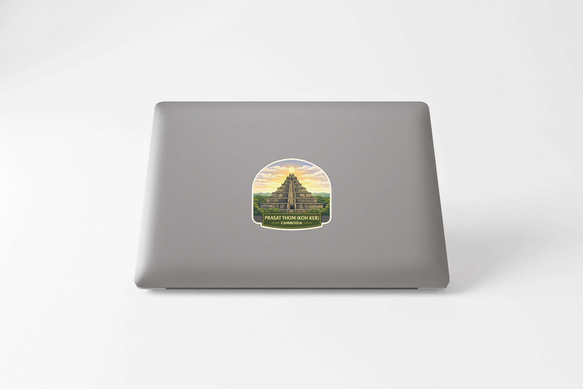 A sticker depicting a temple or building with a sunset in the background.