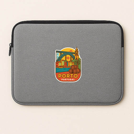 A gray laptop sleeve with a colorful sticker depicting the city of Porto, Portugal.