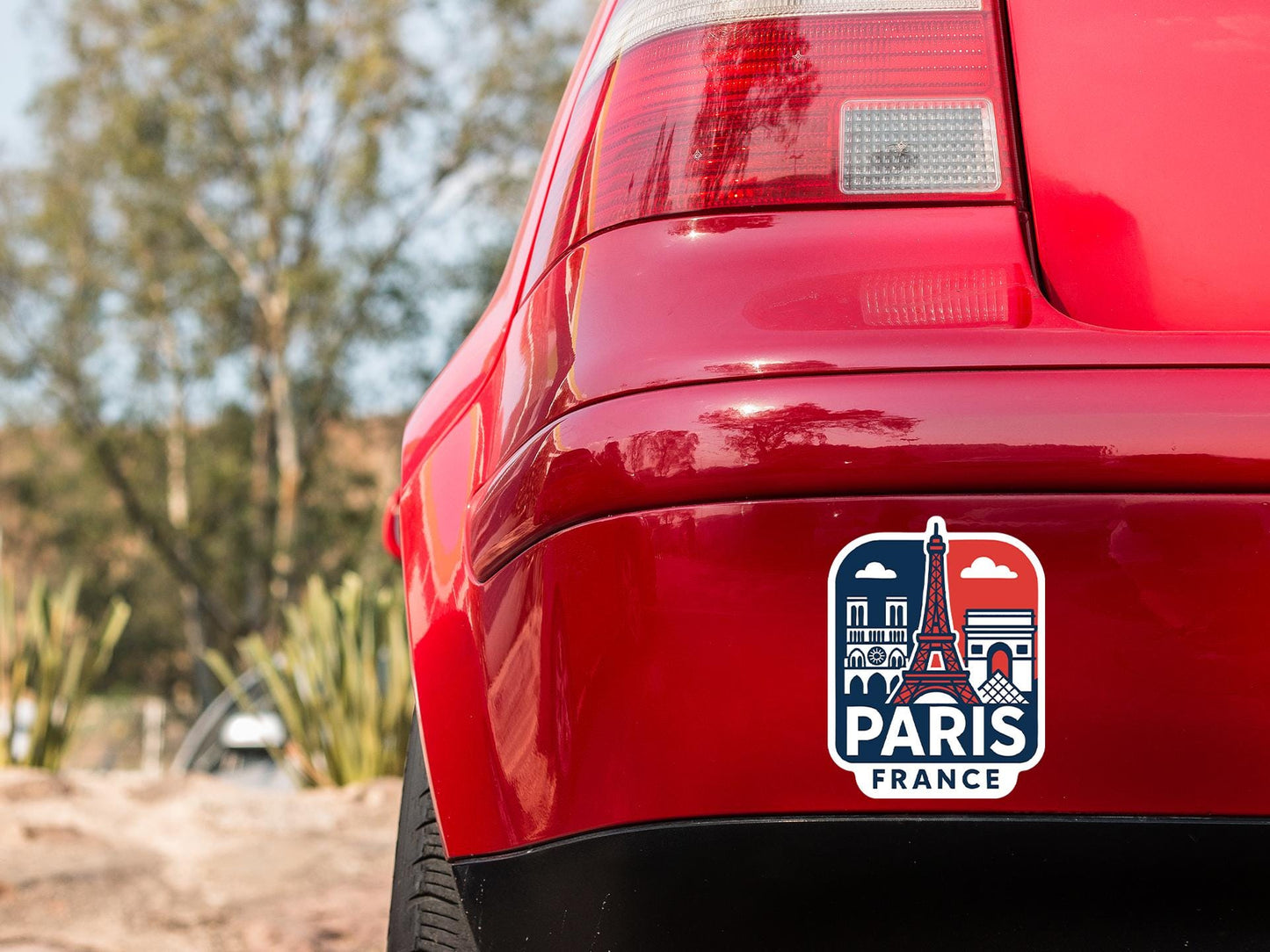 a red car with a sticker on it