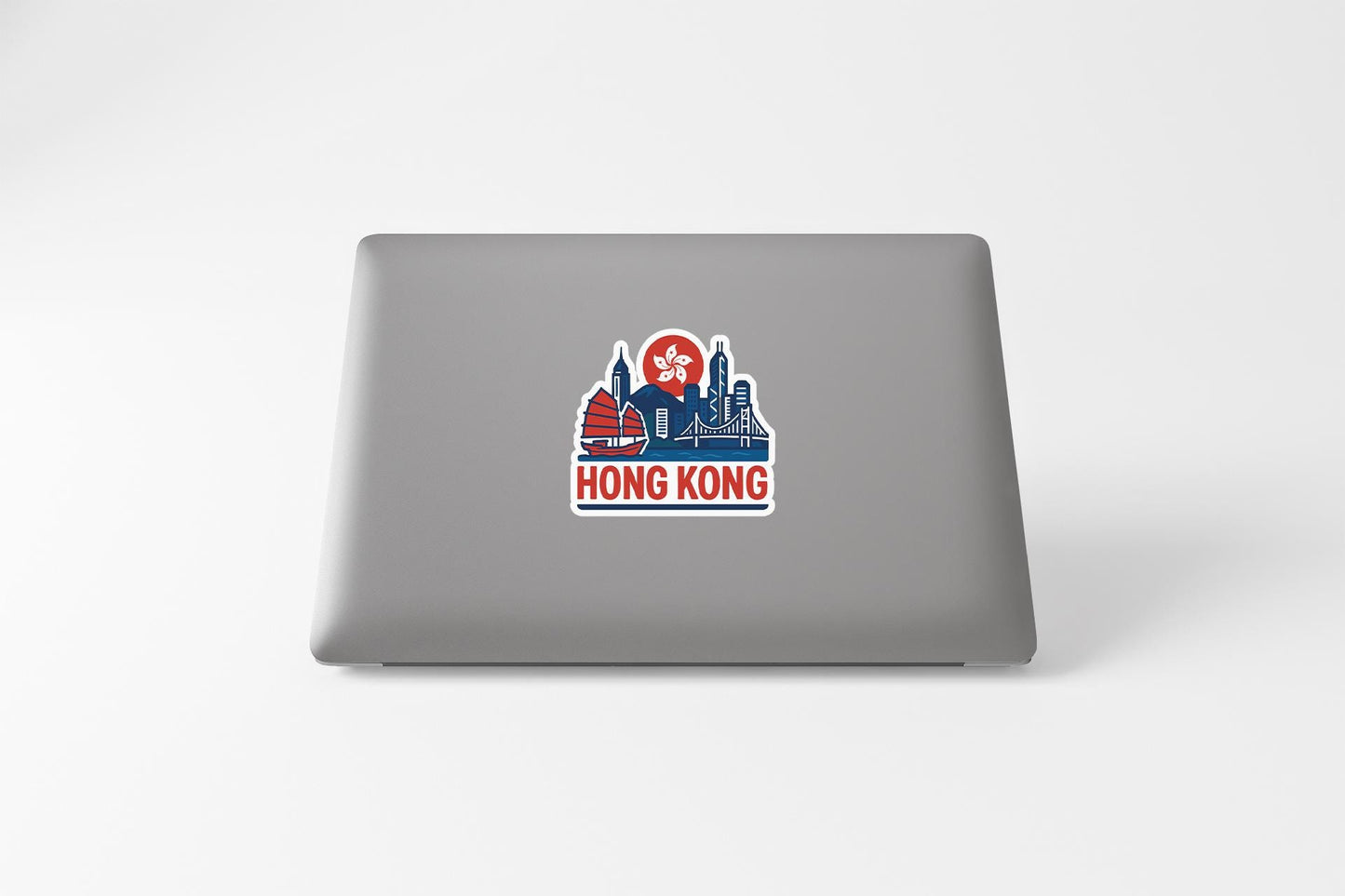 a laptop with a sticker of a city skyline