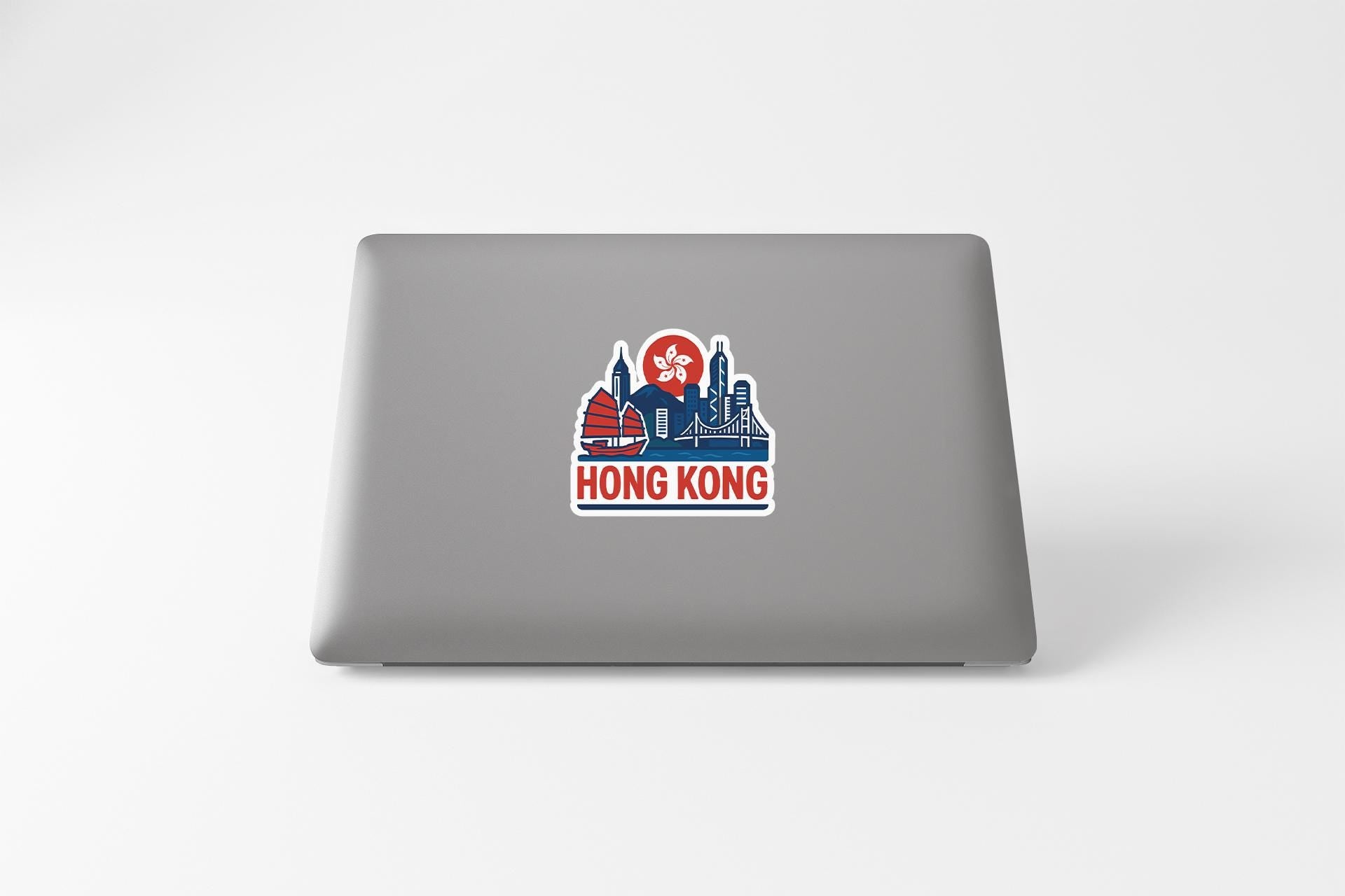 a laptop with a sticker of a city skyline