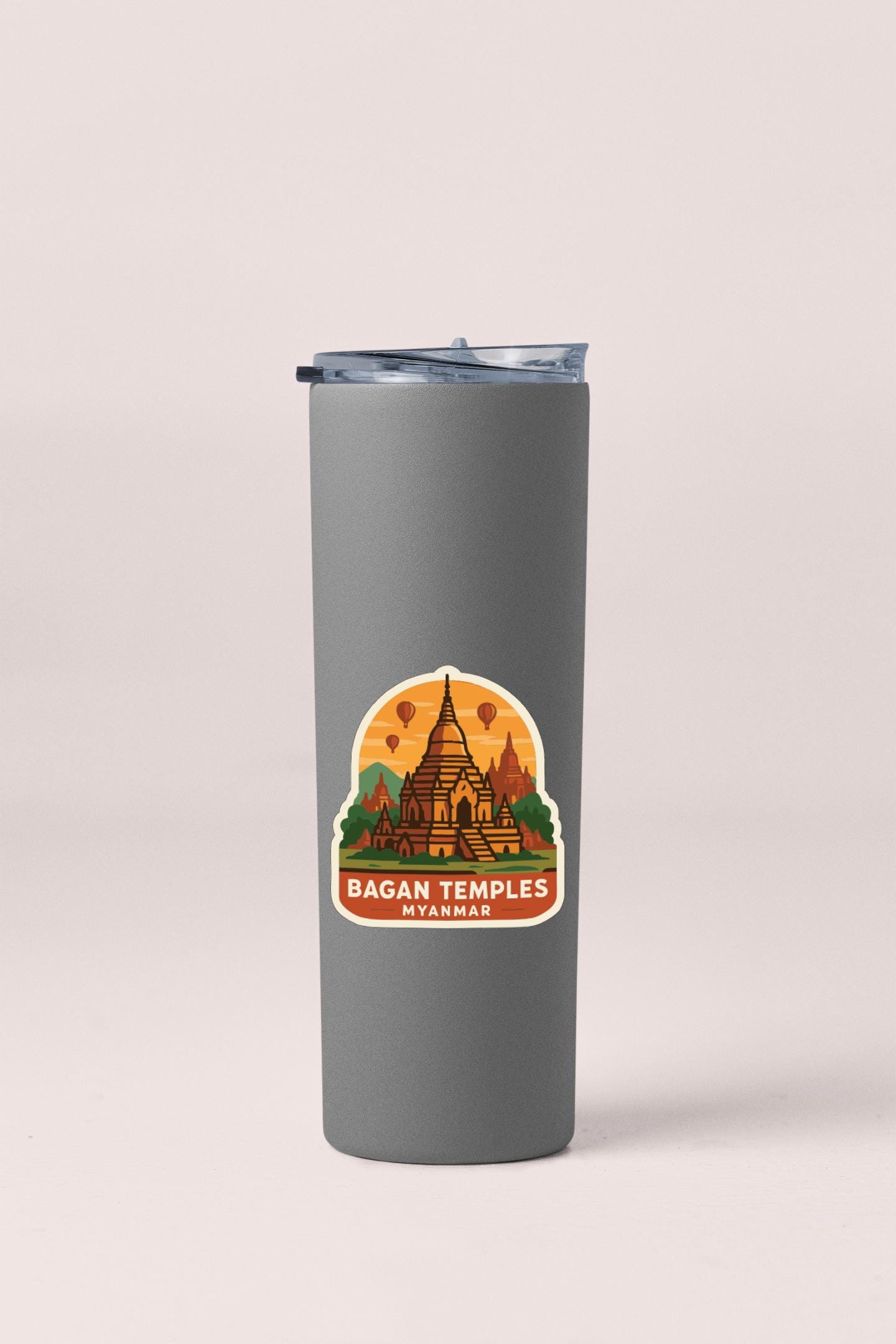A gray insulated tumbler with a sticker depicting the Bagan Temples in Myanmar.