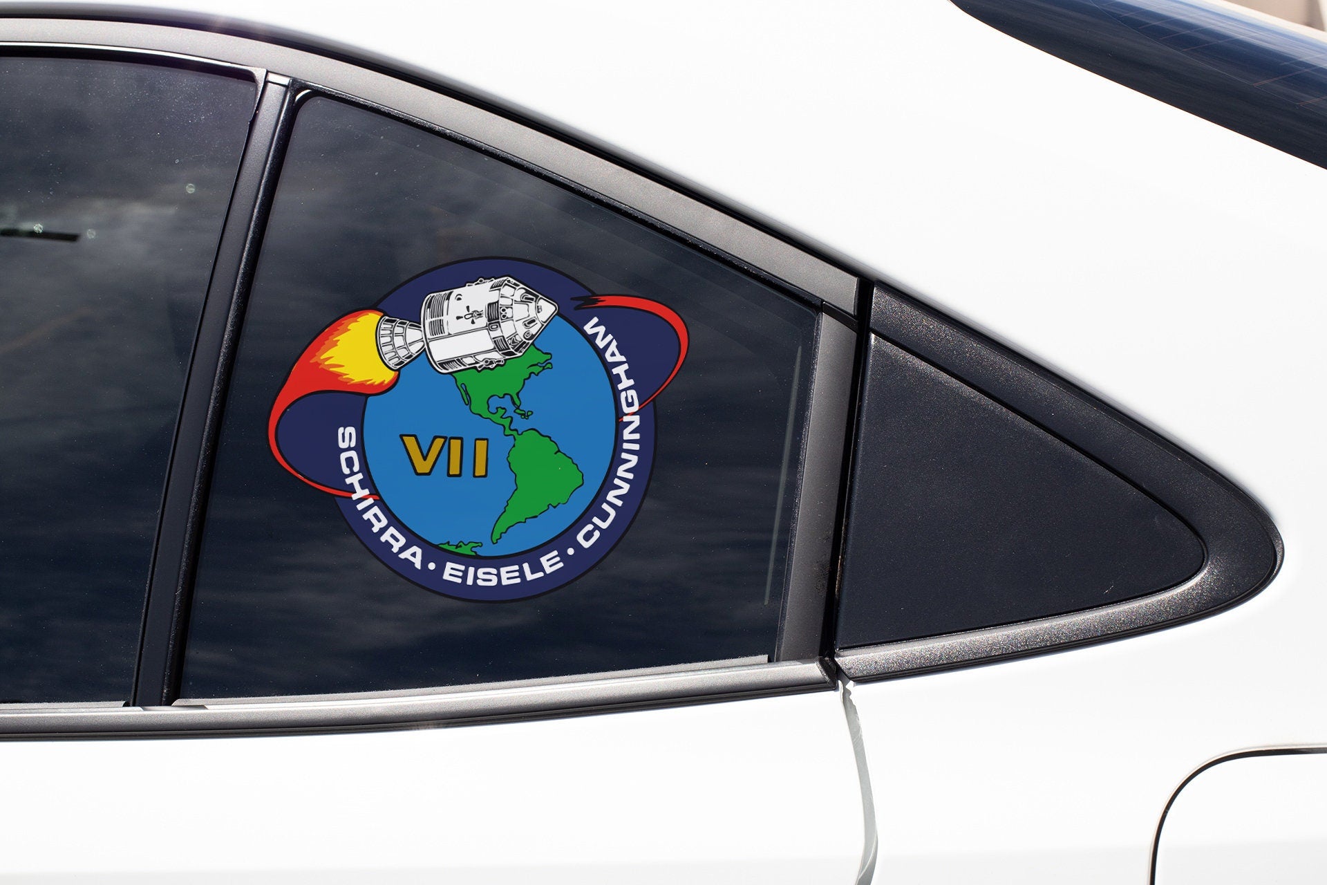 a sticker on the side of a white car