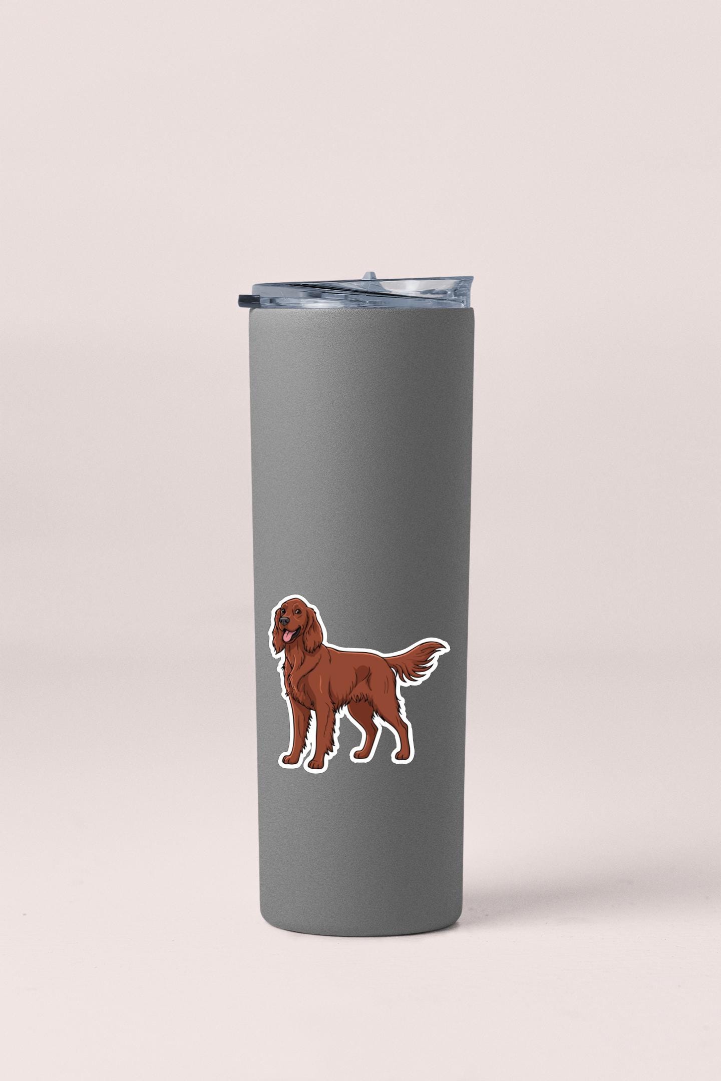 A gray tumbler with a sticker of a brown dog on it.