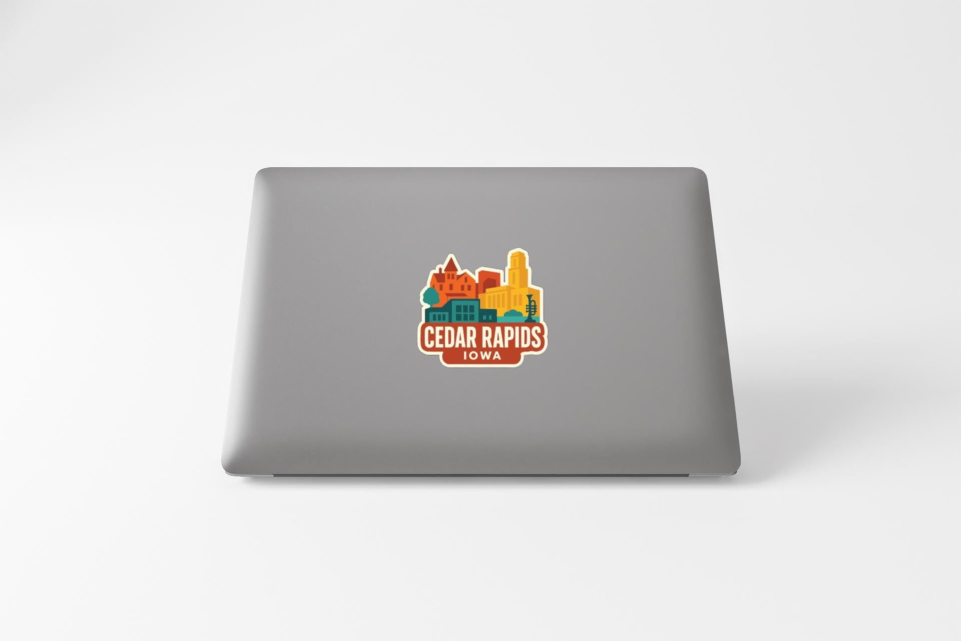 a sticker on the back of a laptop that displays the text "Cedar Rapids, Iowa".