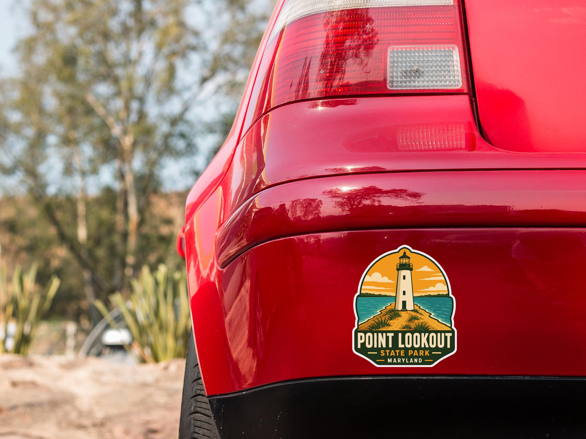 the rear end of a red car with a sticker on the trunk that says "Point Lookout State Park Maryland".