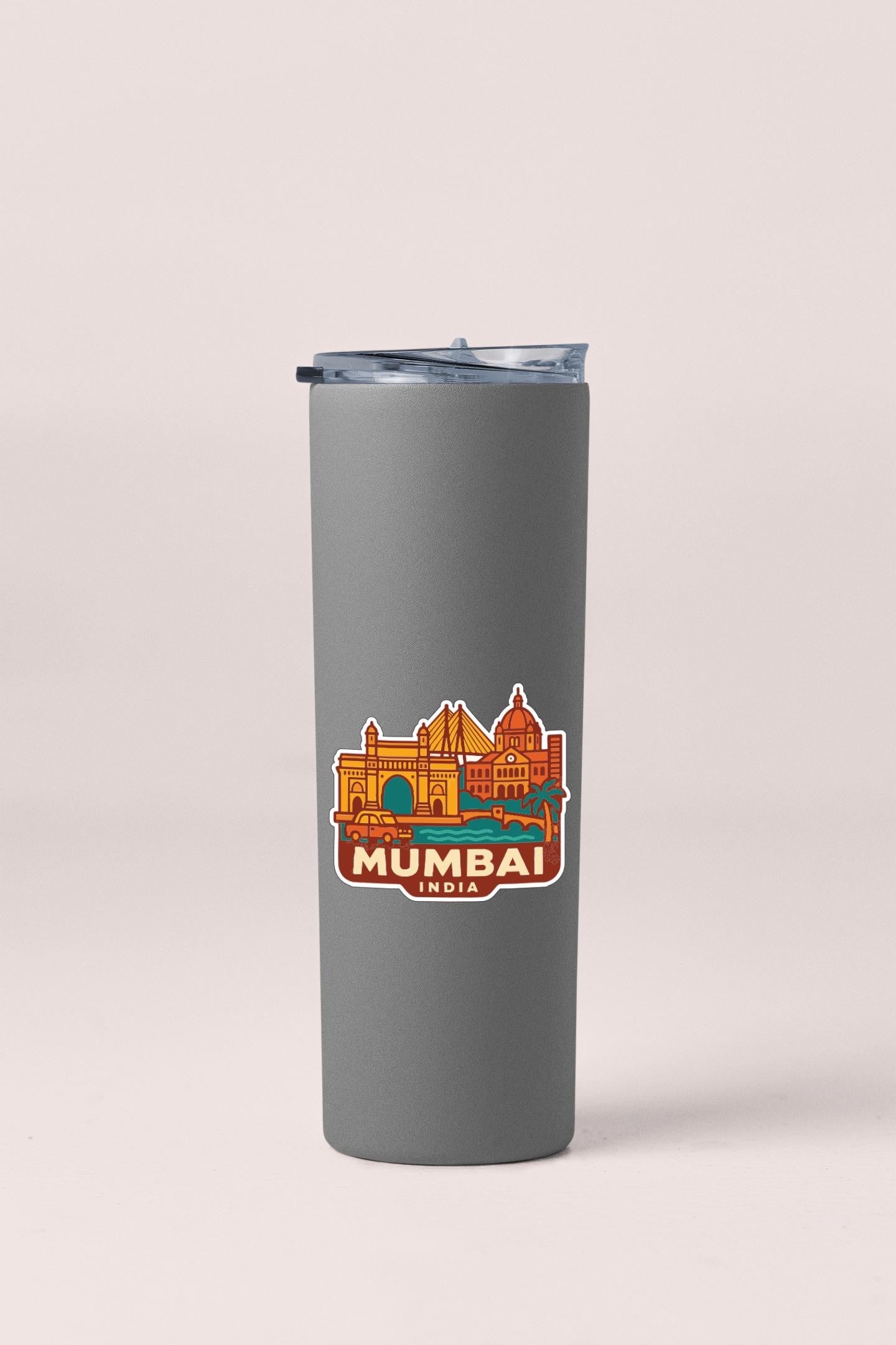A gray insulated tumbler with a sticker depicting the skyline of Mumbai, India.