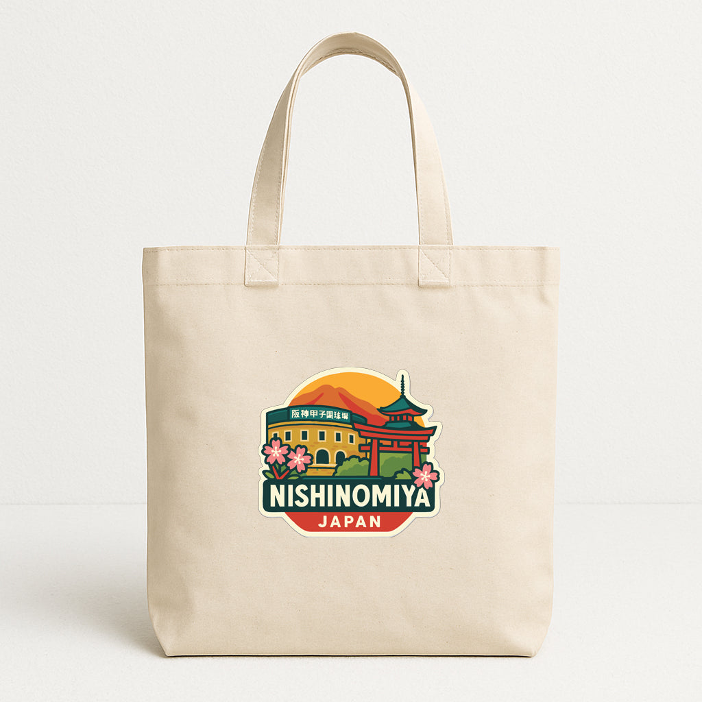 A beige tote bag with a colorful graphic design featuring a temple and the text "NISHINOMIYA JAPAN".