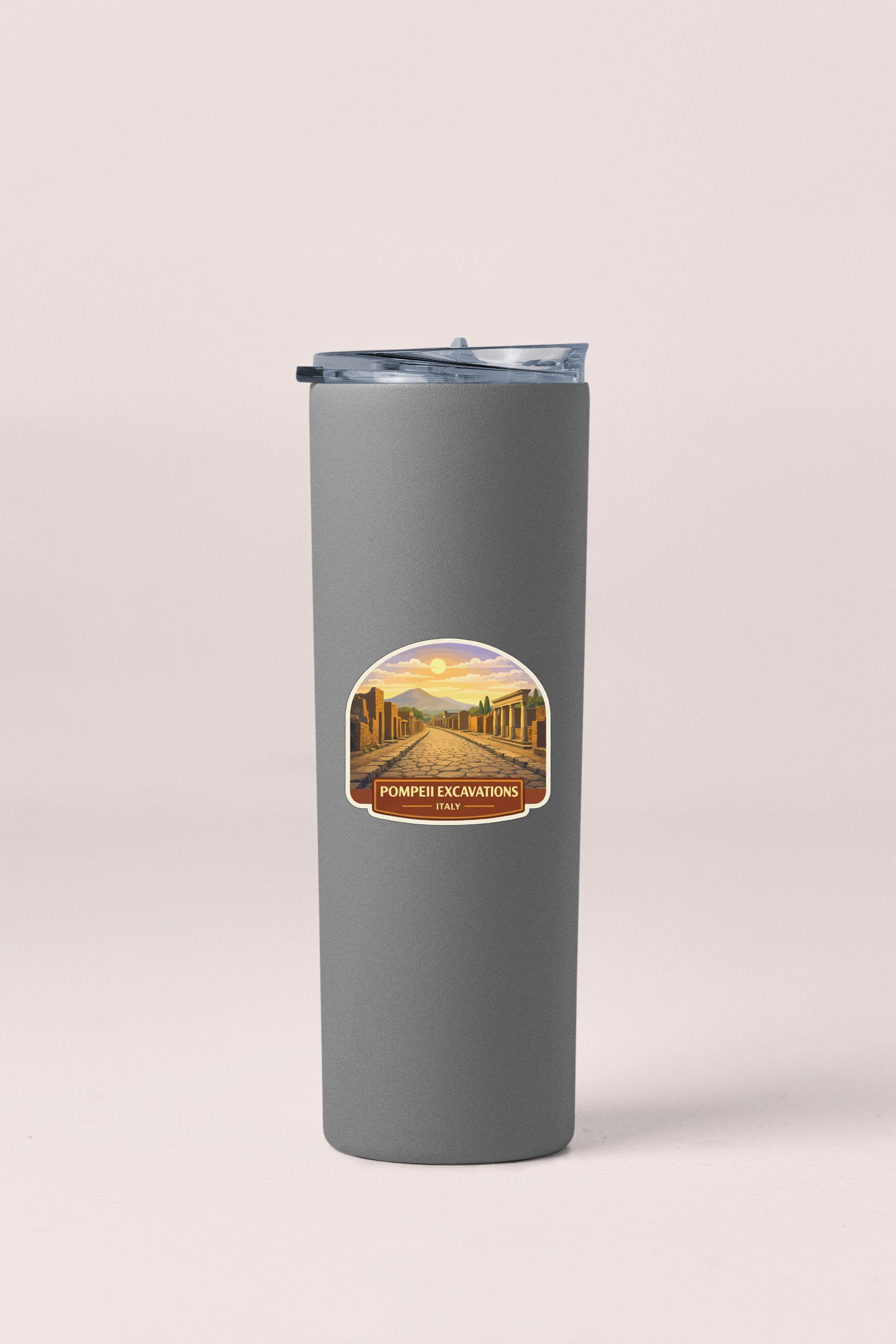 A gray insulated tumbler with a label that says "POMPEII EXCAVATIONS ITALY".