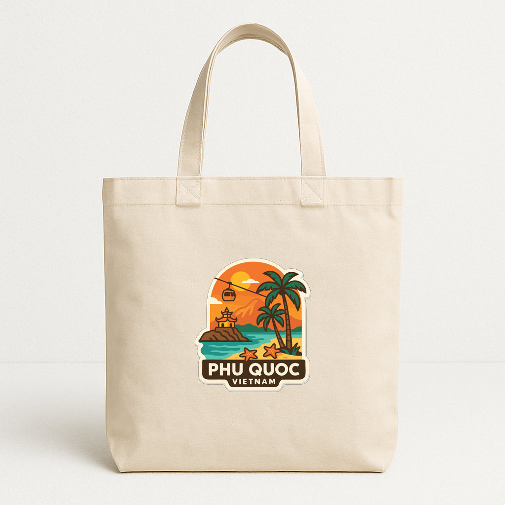 A beige tote bag with a printed design depicting a tropical beach scene with palm trees, a sunset, and a cable car.