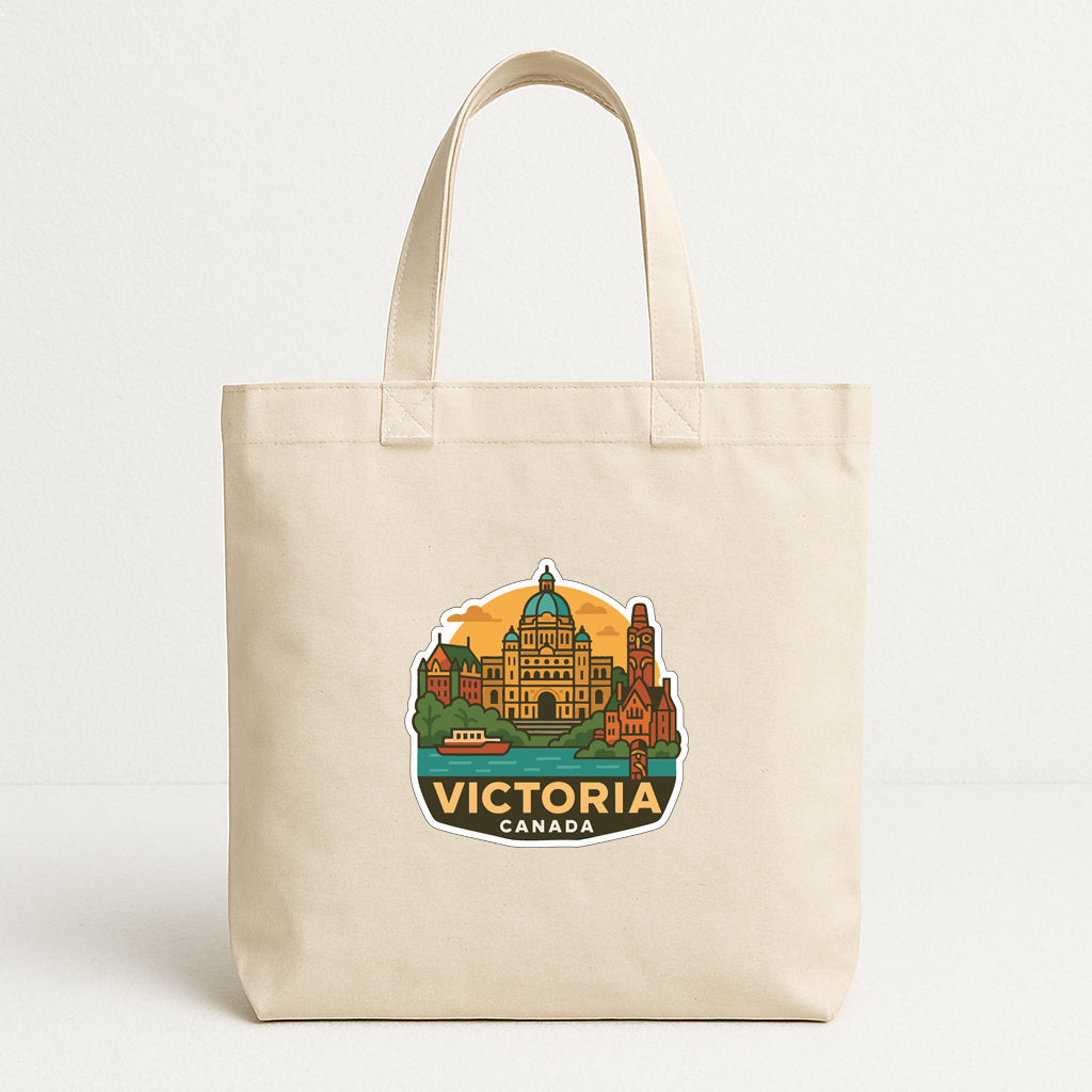 A beige tote bag with a printed design depicting the city of Victoria, Canada.