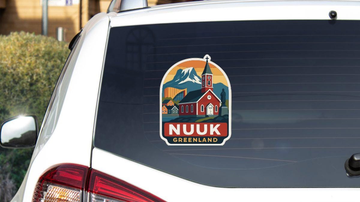 A sticker on the rear window of a car, depicting a church and mountains, with the text "NUUK GREENLAND" printed on it.