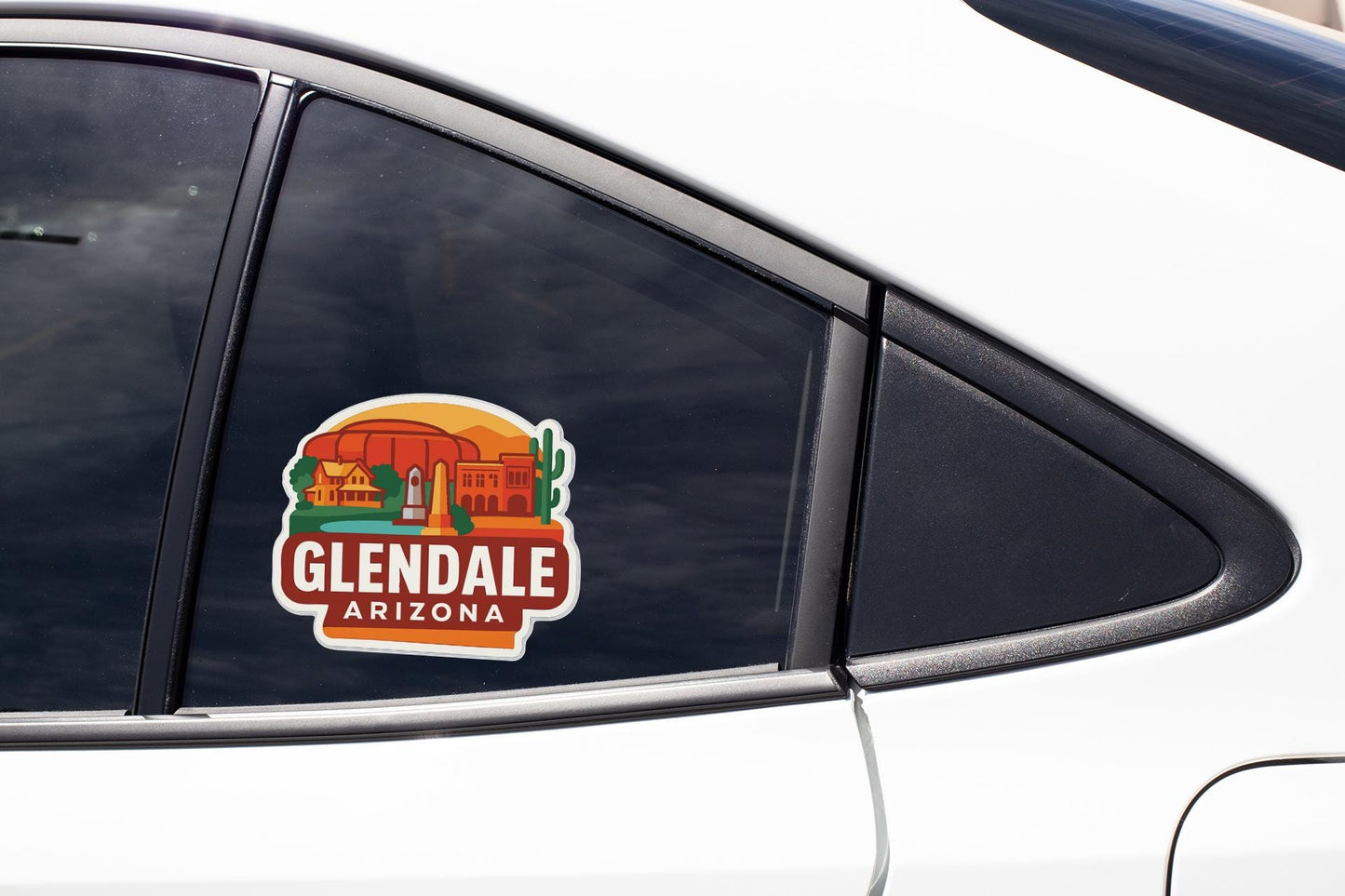 A close-up of a car window with a sticker on it, featuring an illustration of a desert landscape with a building and a cactus.