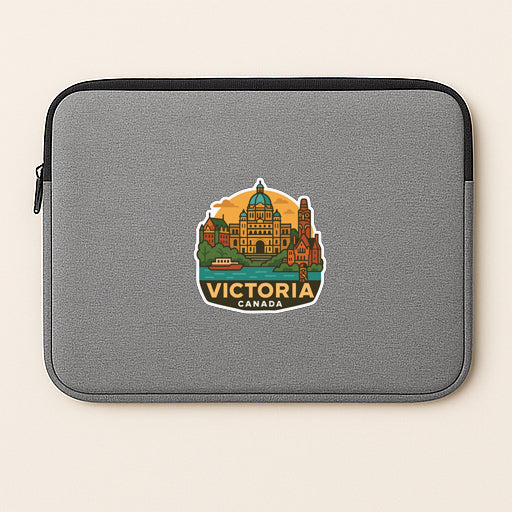 A gray laptop sleeve with a sticker depicting the city of Victoria, British Columbia, Canada.