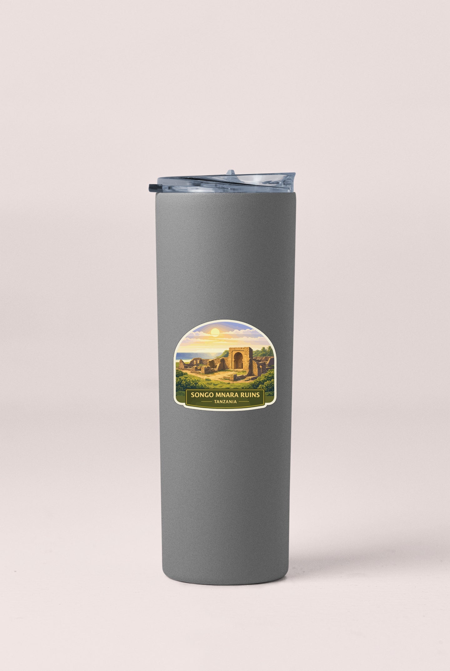 A gray insulated tumbler with a label that says "SONGO MINARA RUTS, ZIMBAI" printed on it.