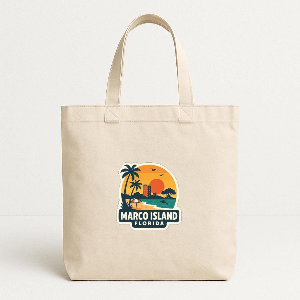 A beige tote bag with a printed design depicting a tropical beach scene with palm trees, a sunset, and a building.
