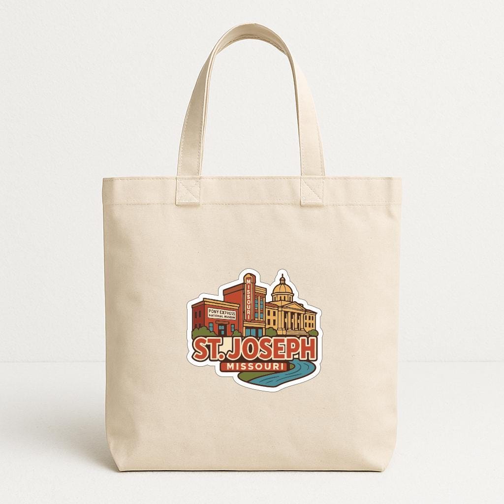 A beige tote bag with a printed design depicting the St. Joseph, Missouri, area.